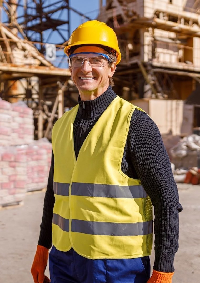 Joyful Man Construction Worker Standing Outdoors At Industrial Site E1694072989208 - GS Machine Automation